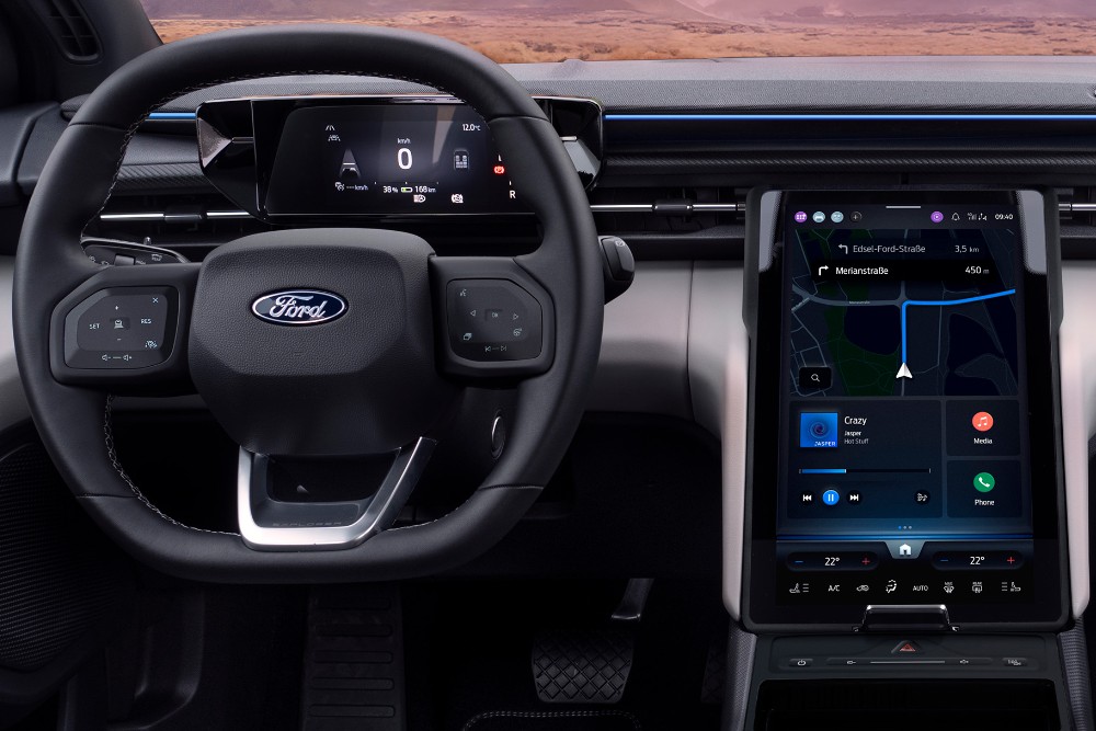 The interior of the all-electric Ford Explorer showing the steering wheel and SYNC Move touchscreen.