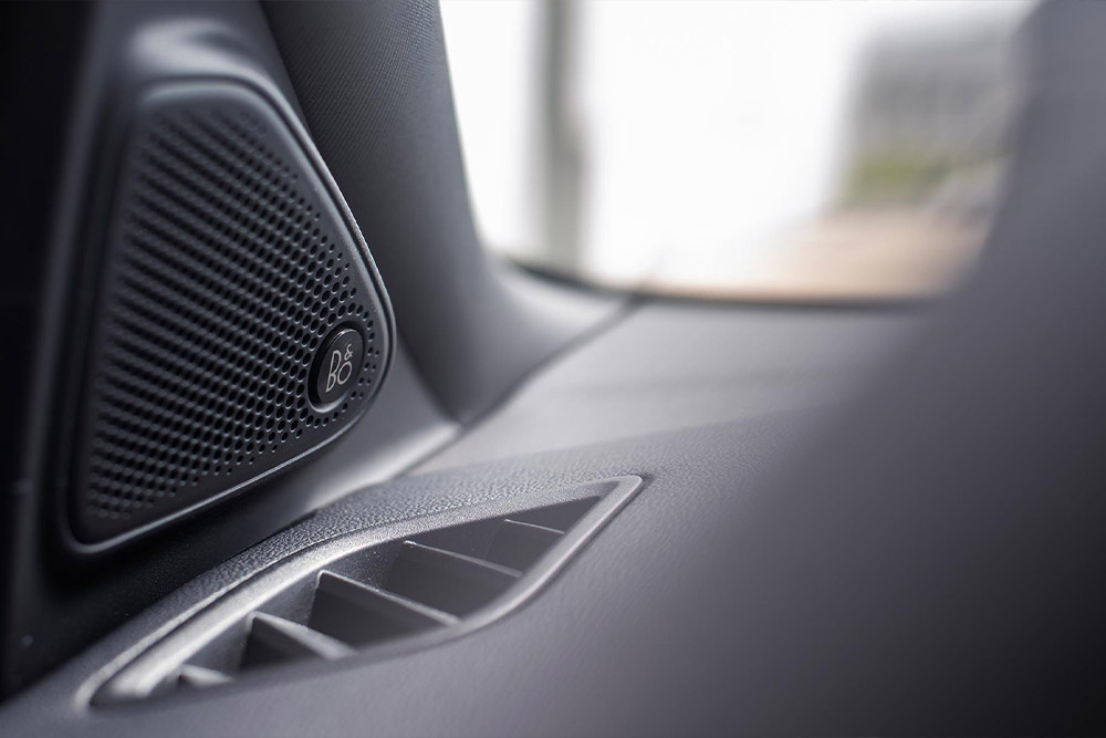 Close up of a Bang & Olufsen audio speaker.