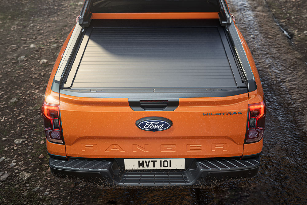 Top view of an orange Ford Ranger's covered truck bed.