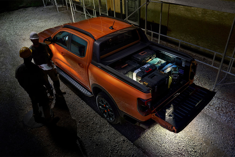 Overhead view of the orange Ford Ranger Wildtrak at night featuring exterior zone lighting.