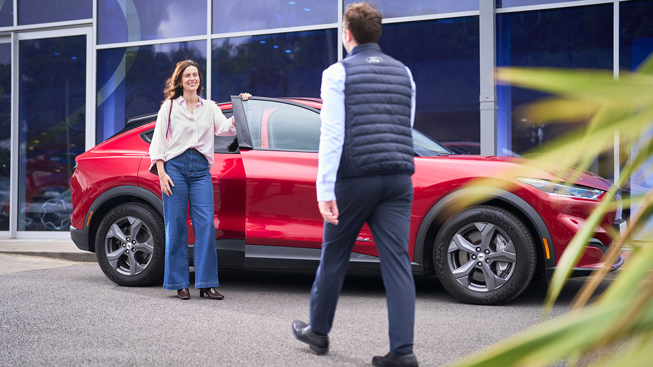 a person speaking to a Ford expert at a Ford service centre.